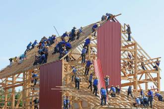 people building structure during daytime