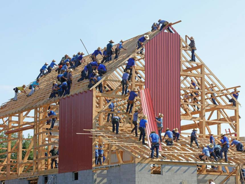 people building structure during daytime