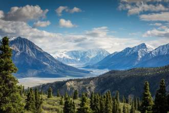 green mountain across body of water