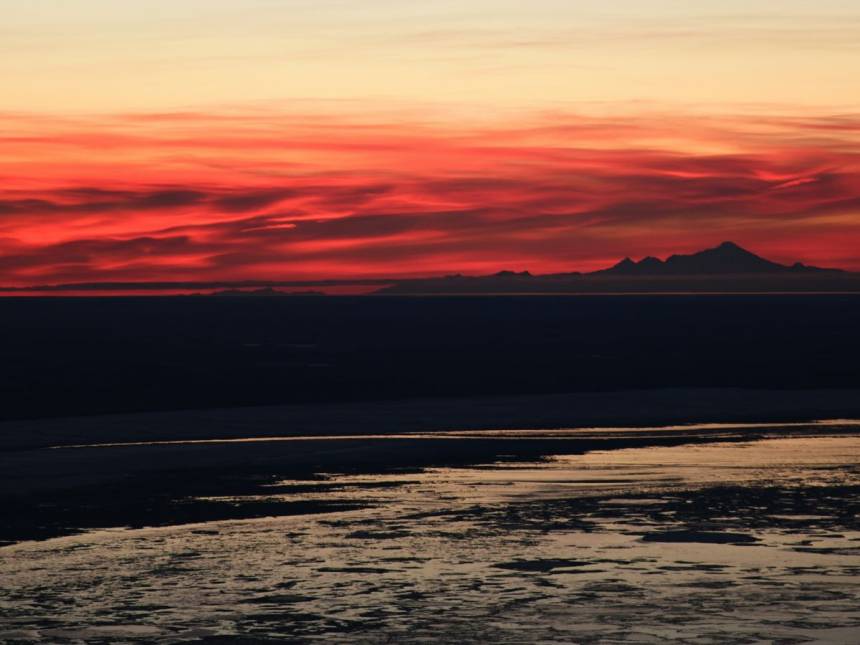 body of water during sunset